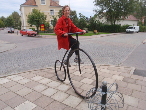 Terry rides a Penny Farthing Sculpture.